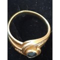 18ct yellow gold ring with blue sapphire centre stone