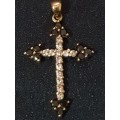 9ct gold cross  with black and white stones