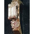 Genuine 18ct and 1/2 carat straight baguette cut Diamond Ring with 2 round cut diamond either side