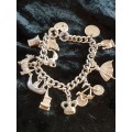 Stunning-heavy genuine silver charm bracelet with all the charms