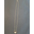Delicate 9ct gold necklace with 7 friendship rings