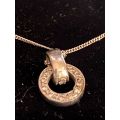 9ct white gold chain with a 9ct white gold and diamond Halo pendant