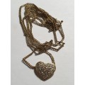 Diamond heart shaped pendant on 18ct gold chain
