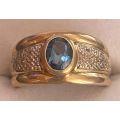 Diamond and Blue Oval Topaz Ring set in 9ct yellow gold