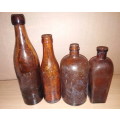 A Collection of 4 Vintage Amber Bottles