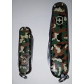 TWO CAMOUFLAGE VICTORINOX MULTI-TOOL KNIVES (SPARTAN AND CLASSIC MODELS)