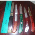 A Collection of 5 Folding Knives with Wooden Handles