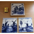 A Collection of three Delft tiles with windmill theme and one tile holder