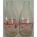 Two Old Clover Milk Bottles  (Some staining in the second bottle)