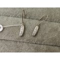 Charming Silver Dangling Earrings