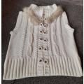 Sleeveless knit cardigan with faux fur collar
