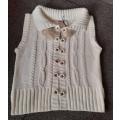 Sleeveless knit cardigan with faux fur collar