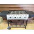 Large 4 burner gas braai, like new with wheels and side tables