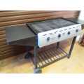 Large 4 burner gas braai, like new with wheels and side tables