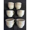 6 Floral porcelain tea cups with silver trim New