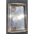 AN ANTIQUE SILVER PLATED SERVING TRAY STAMPED SP ON K