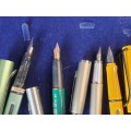 A COLLECTION OF 4 FOUNTAIN PENS SOLD AS IS