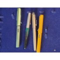 A COLLECTION OF 4 FOUNTAIN PENS SOLD AS IS