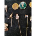 A COLLECTION OF VINTAGE BADGES ANDPIN SOLD AS IS