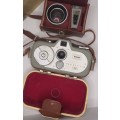 AN ANTIQUE MOVIE CAMERA  A ZEIS IKON MOVIENETTE COMPLETE WITH ATTACTMENTS