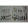 A VINTAGE MIXED COLLECTION OF EPNS AND STEEL CUTTLERY SOLD AS IS
