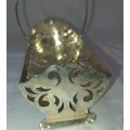 A VINTAGE SILVER PLATED BISCUITE BASKET SOLD AS IS