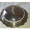 A VINTAGE BUTTER DISH EPNS WITH A CRYSTAL BOWL AND A LID SOLD AS IS