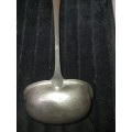 A VINTAGE METAL  SOUP LADEL FOR CATERERS OR COLLECTORS SOLD AS IS