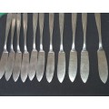 A VINTAGE SET OF FISH KNIVES AND FORKS MADE BY KRIIUS SOLINGEN SOLD AS IS