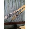 A VINTAGE FISH KNIFE AND FORK SET WITH BONE TYPE HANDES  EPNS AI STILL IN ITS ORIGINAL PADDED BOX S