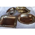 A COLLECTION OF VINTAGE EPNS SERVING TRAYS SOLD AS IS