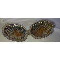 A SILVER PLATED SCALOP SHELL WITH A GLASS BUTTER DISH SOLD AS IS