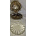 A SILVER PLATED SCALOP SHELL WITH A GLASS BUTTER DISH SOLD AS IS