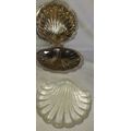 A SILVER PLATED SCALOP SHELL WITH A GLASS BUTTER DISH SOLD AS IS