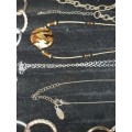 A COLLECTION OF COSTUME NECKLACES AND PENDANTS