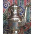 A VINTAGE ORNATE TEA KETTLE MADE BY REGAL AI SPC SOLD AS IS