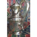 A VINTAGE ORNATE TEA KETTLE MADE BY REGAL AI SPC SOLD AS IS