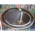 AN EXTRA LARGE STAINLESS STEEL OVAL SERVING TRAY