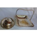 TWO VINTAGE SILVER PLATED ITEMS A BUTTER BOWL WITH A LID AND A SERVING BASKET SOLD AS IS