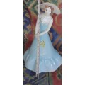 A COLLECTION OF VINTAGE PORCELAIN FIGURINES IN MINT CONDITION SOLD AS IS