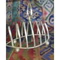 A SILVER PLATED TOAST STAND IN GOOD CONDITION SOLD AS IS