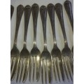 A vintage set of 12 desert forks Sold as is