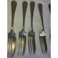 A JOBLOT VINTAGE STAINLESS NICKLE SILVER DESERT FORKS SOLD AS IS