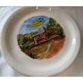 A CABIN IN THE WOODS BY JORDAN 99 PORCELAIN WALL PLAQUE SOLD AS IS