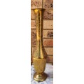 A VINTAGE FLUTED VASE MADE OF BRASS SOLD AS IS