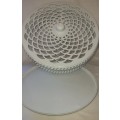 A WHITE ENAMEL PAINTED STEEL CAKE TRAY WITH AN ORNATE LID SOLD AS IS
