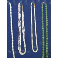 A COLLECTION OF SIMULATED PEARLS , CULTURED PEARLS AND JADE ICE NECKLACES SOLD AS IS