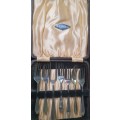 AN ANTIQUE DESERT FORKS SET IN ITS ORIGINAL BOX SOLD AS IS