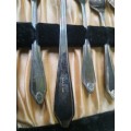 AN ANTIQUE DESERT FORKS SET IN ITS ORIGINAL BOX SOLD AS IS