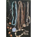 A COLLECTION OF VINTAGE COSTUME NECKLACES SOLD AS IS